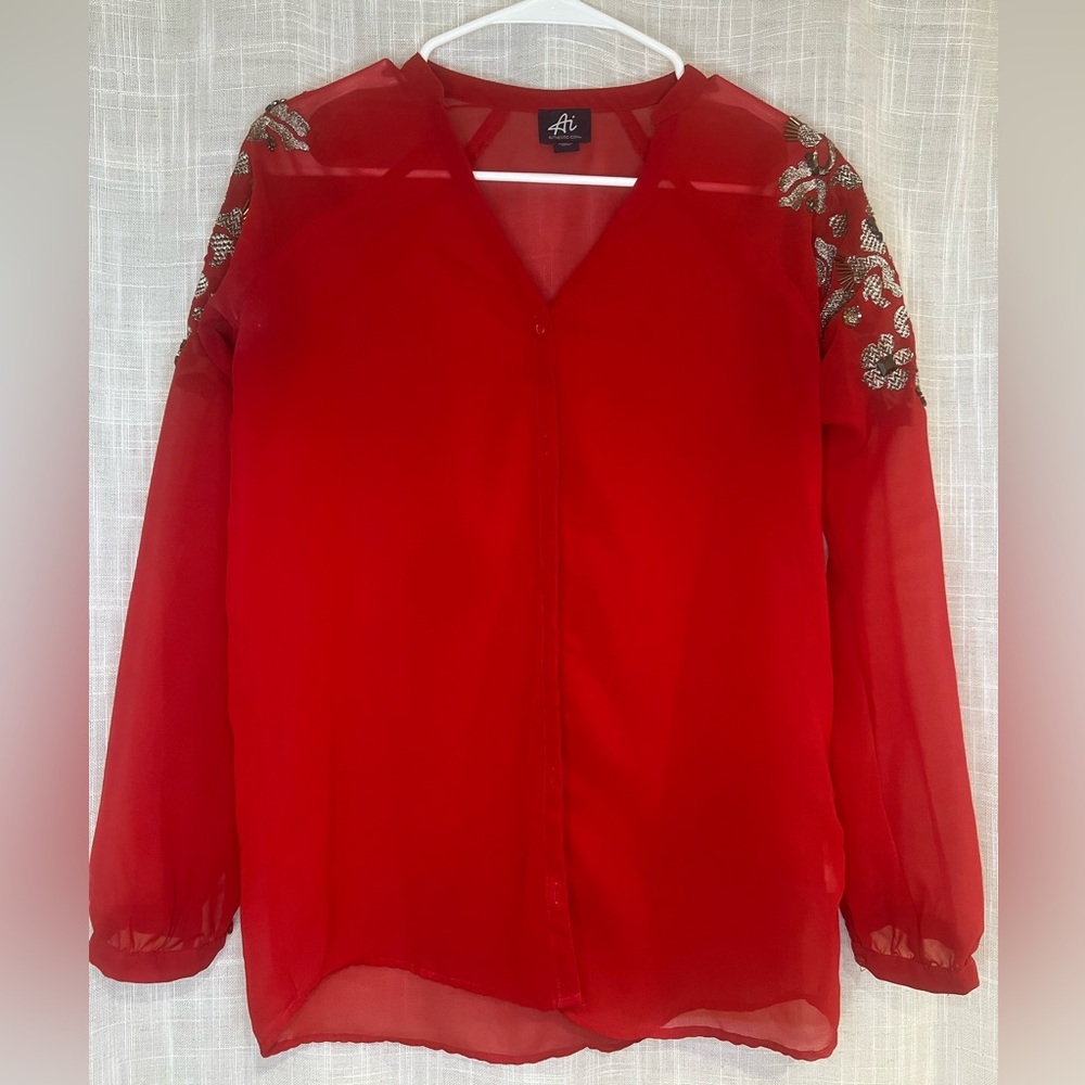RED BLOUSE WITH DETAILED STITCHING